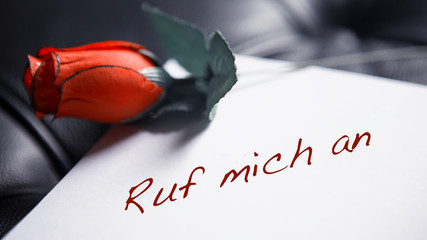 handwritten note with german words ‘call me’