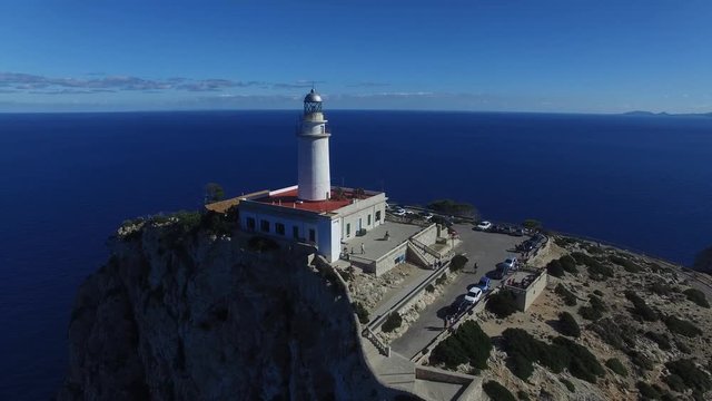 The lighthouse at Cape Formentor. Aerial view.  Flying around lighthouse at Cape Formentor.