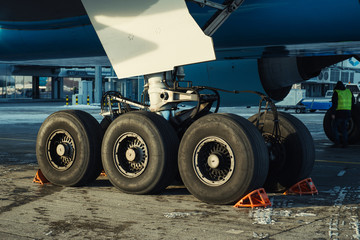 Obraz na płótnie Canvas Landing gear of airplane under maintenance