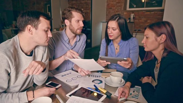 Group of young people in business meeting showing teamwork. Startup