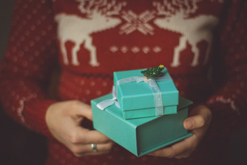 Two gift boxes in female hands