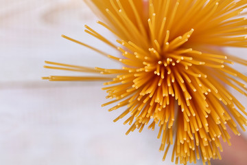 Uncooked spaghetti close up. Cooking pasta background