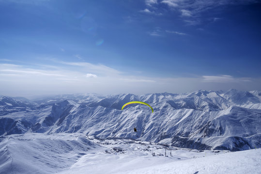 Winter in Greater Caucasus Mountains. Georgia (country). Gudauri ski resort. Paragliding.