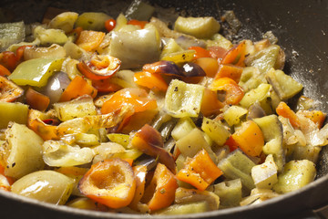 bell peppers frying in a skillet