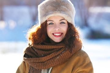 Beautiful young woman outdoors on winter day
