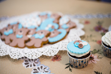 Beautiful blue cupcake and plate with teddy bears cookies biscuits