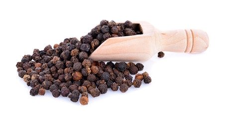 pepper corn in scoop on white background