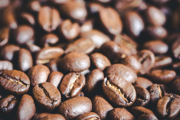 Coffee beans closeup macro background.
