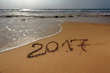 Happy New Year 2017, lettering on the beach, background