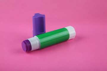 Glue Stick on Pink Background 