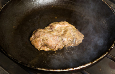 A free range, succulent duck breast fillet being seared and pan fried, until golden and crispy.