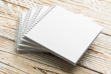 Blank book mock up on wooden background