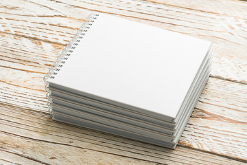 Blank book mock up on wooden background