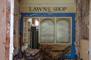 lancashire, England, 04/04/2014, Whittingham Mental Asylum, An old abandoned shop with peeling paint , in an abandoned building. Exploring urban decay.