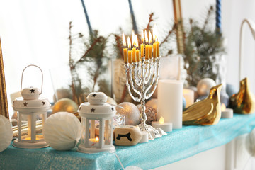 Menorah and decorative elements near mirror. Hanukkah concept