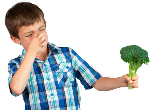 Boy Looking at Broccoli with Disgust