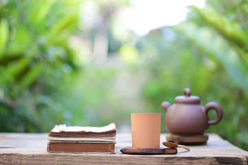 Old vintage teapot and notebooks at outdoor