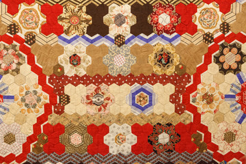 Vintage fabric texture of colorful pattern of hexagonal patches