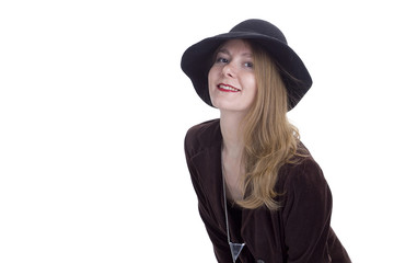 Fototapeta premium Portrait of a young woman in a hat
