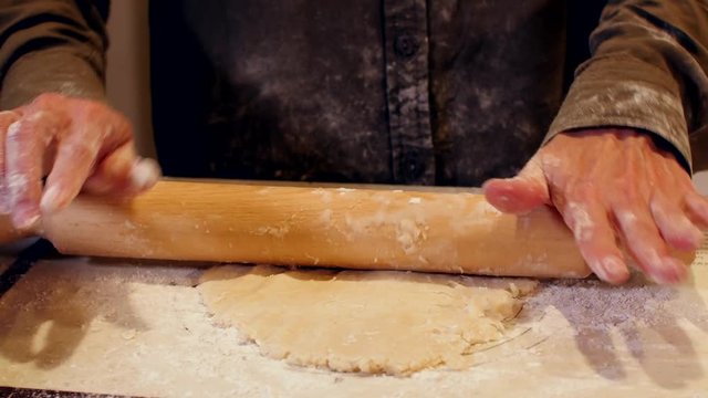 rolling pie dough - close up on hands