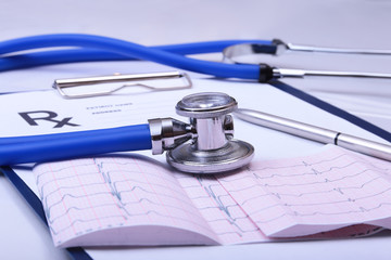 Stethoscope and medical equipment on a light blue background