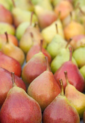 pears on the counter market as background