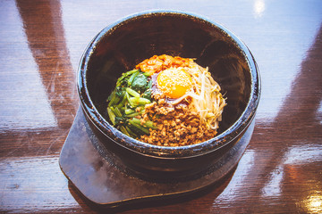 Bibimbap in a heated stone bowl, Korean food
