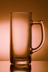 Glass for beer drink on a pink background. Glasswares