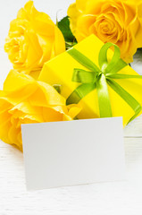 Mother's day, Valentine's or birthday concept. Present, roses and empty card.