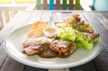 Steak beef tenderloin on wooden table for lunch.