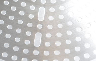 Abstract metal surface. Image a bit over exposed. Surface from a brand new frying pan.