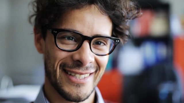 smiling young man in eyeglasses