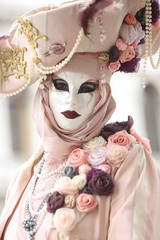 Venice carnival - masked lady with flower in pastel color