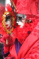 Venice mask red lady watching in the mirror