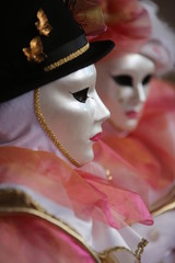 Fototapeta na wymiar Venice mask close up pink costume