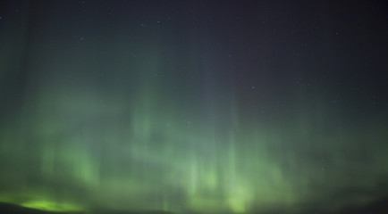 Northern lights illuminating the sky. Magical moment in Finland. Aurora borealis is beautiful phenomenon