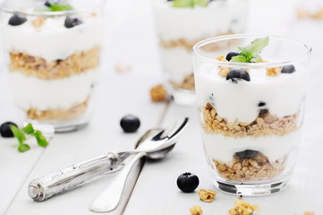 Delicious homemade dessert granola and blueberry yogurt parfait