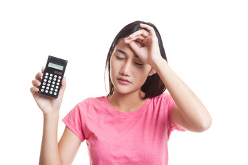 Asian business woman got  headache with calculator.