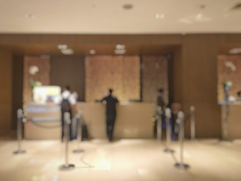 Abstract blur of people check-in at reception counter in hotel