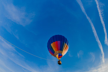 Colorful hot air balloon in blue sky