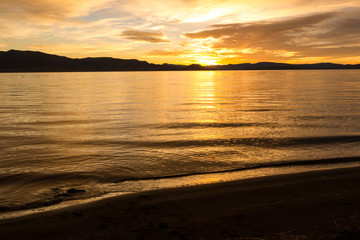 Long exposure during sunrise over a large lake