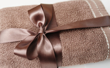 Brown towel tied with a bow