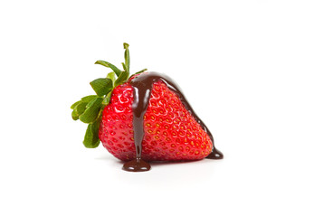 Strawberry with dripped chocolate syrup isolated on a white background