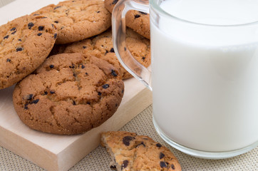 Glass cup with milk and oatmeal cookies