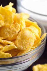 Cornflakes in a transparent bowl closeup