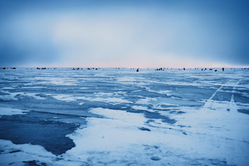 Naklejka premium Dawn on the frozen Baltic Sea Biosphere polygon. Ice fishing for