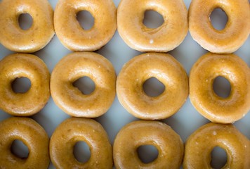 Many donuts in a row.