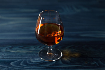 Brandy glass on the wooden table