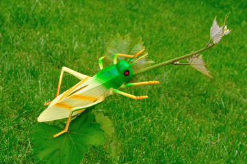 Plastic grasshoppers in the garden
