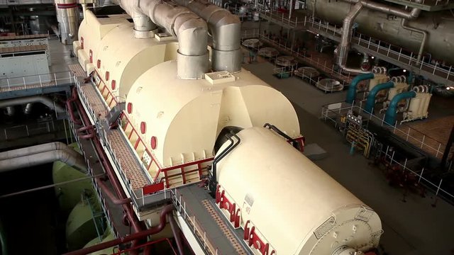 A turbine generator in the engine room of a nuclear power plant. HD
